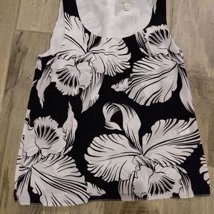 Dana Buchman size S black shirt with white floral design. Sleeveless. NWOT